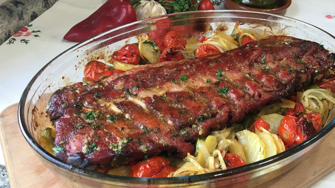 costillas al horno con patatas y cebolla