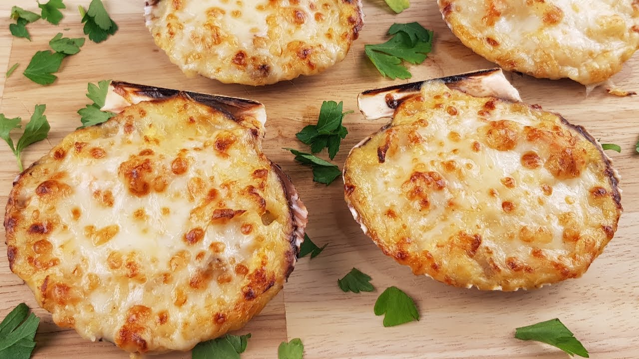 vieiras rellenas de merluza y gambas