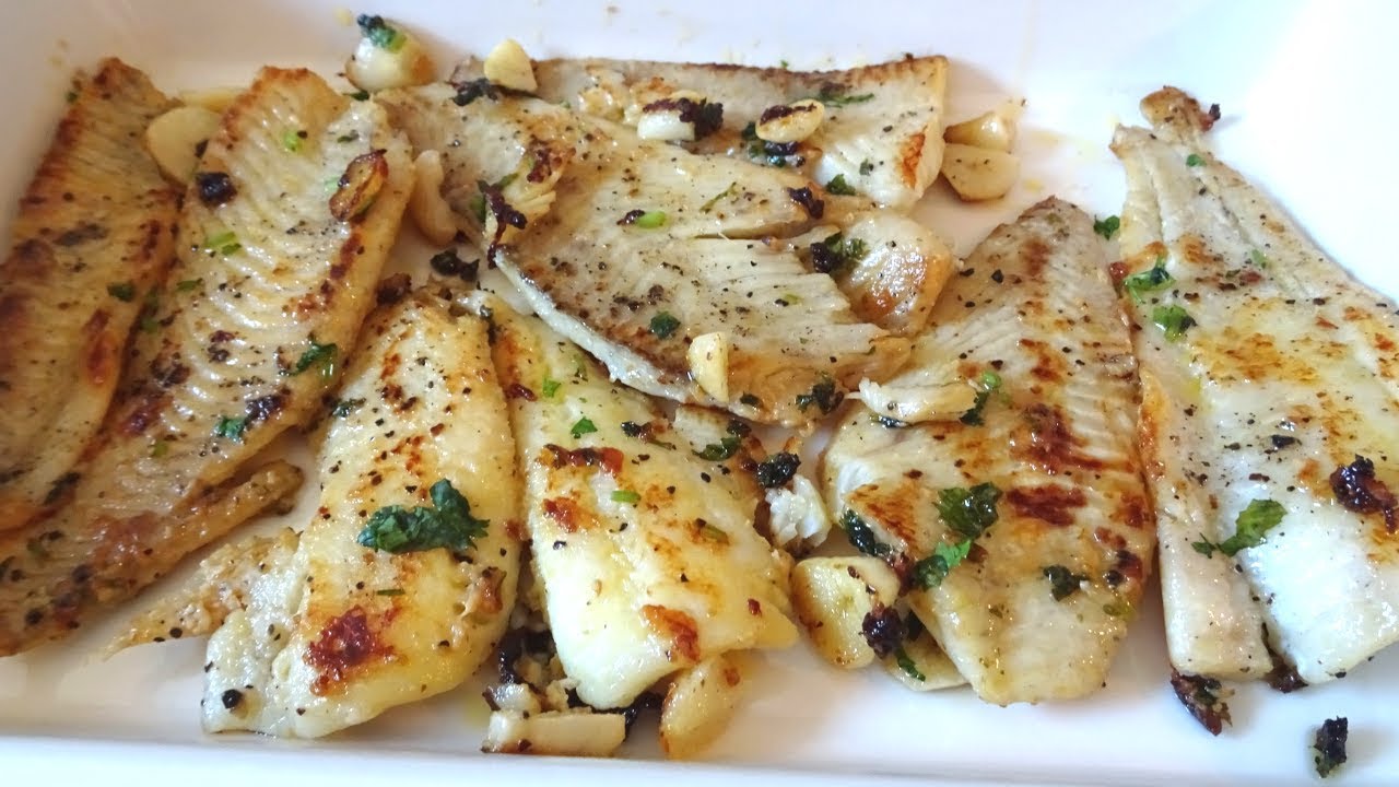 merluza con cebolla y vino blanco